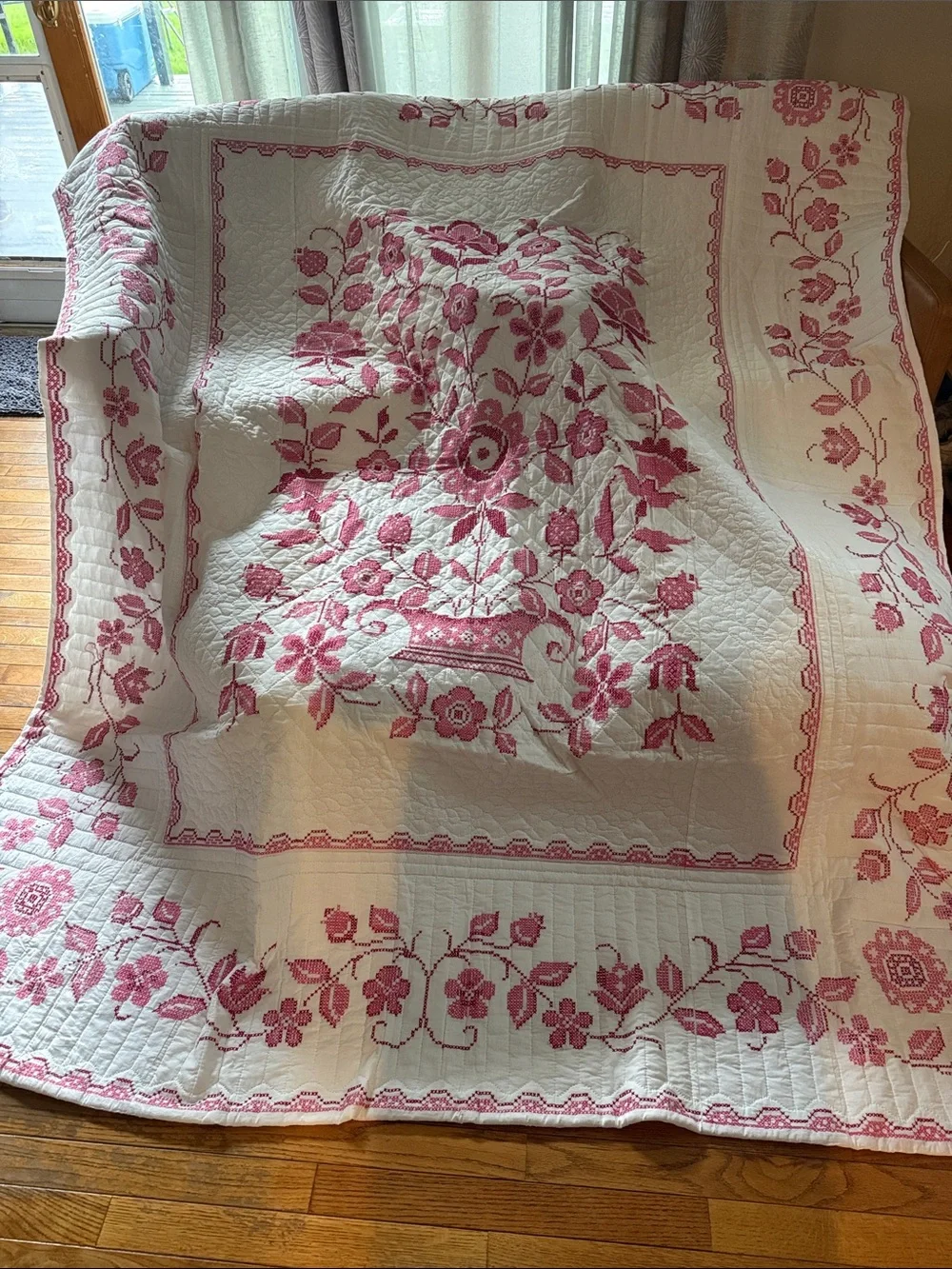 White Quilt with Pink Floral Basket Motif